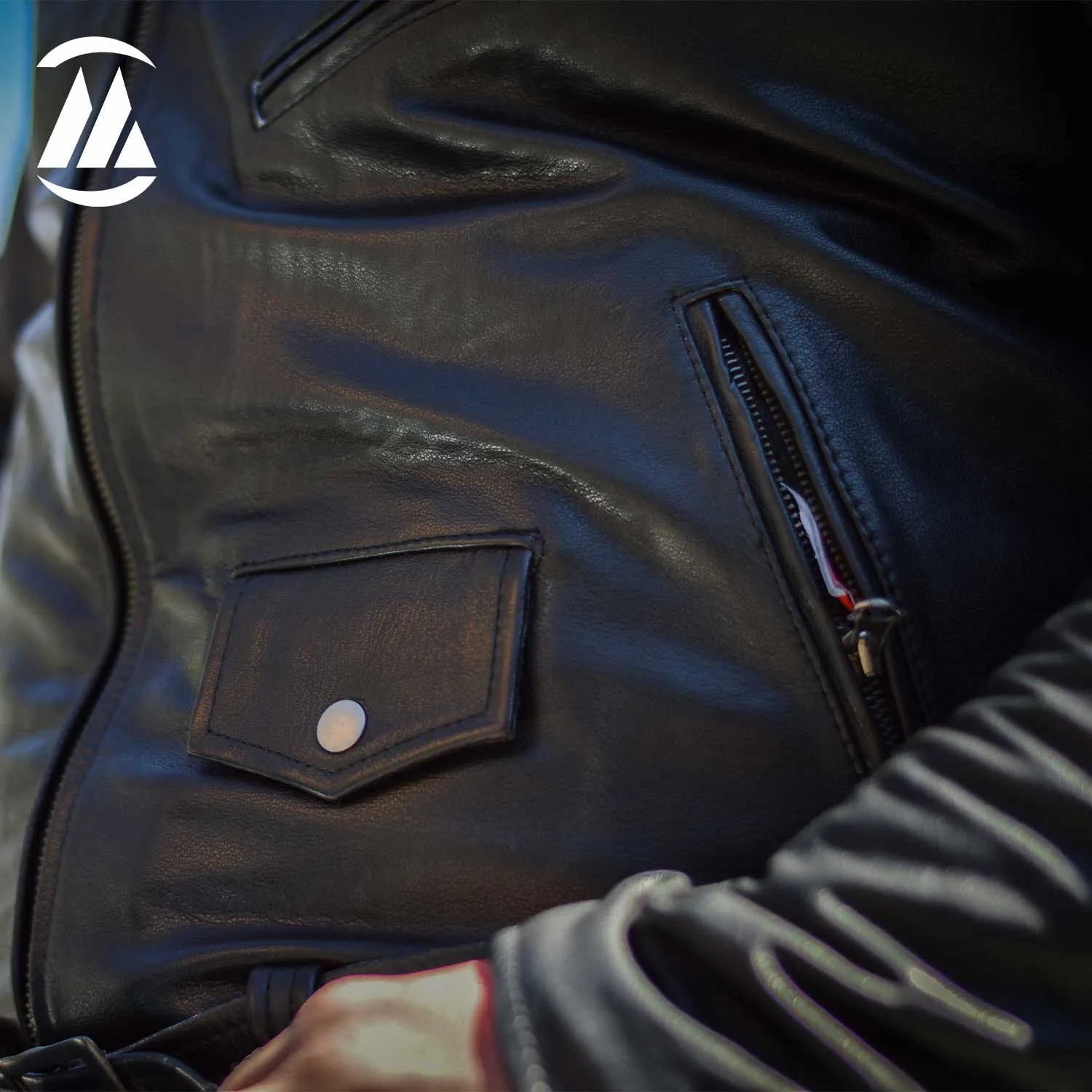 Three front pockets with zipper and one pocket with snap button